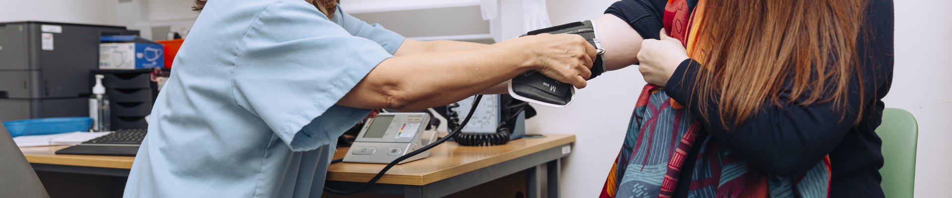 Doctor taking a patient's blood pressure